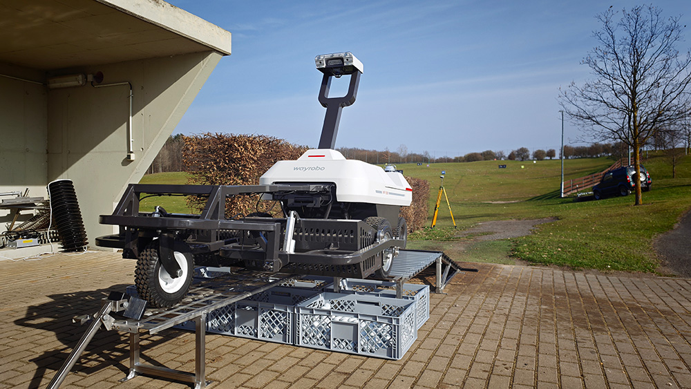 WayPick 2 robot golf ball picker collecting balls on a driving range