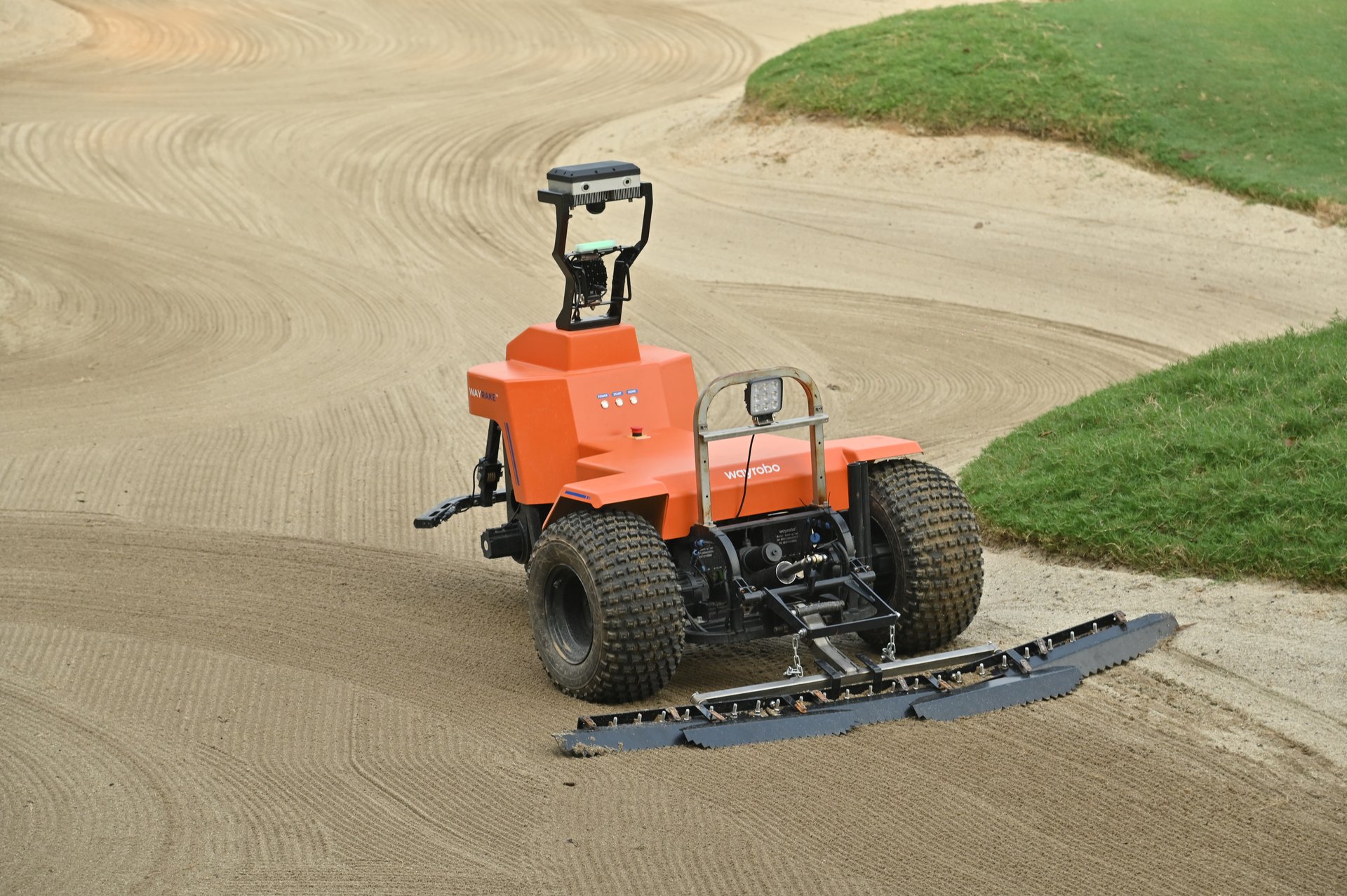 WayRake 9 robotic bunker rake maintaining a golf course bunker